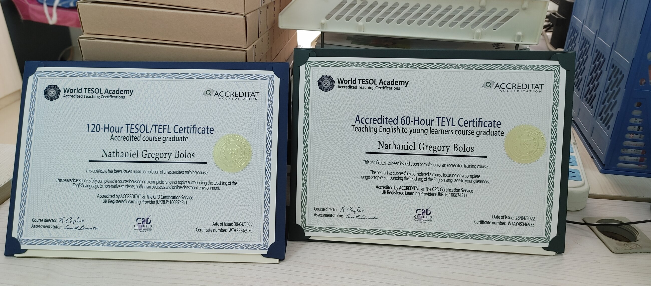 Proudly displaying my certificates on my desk.