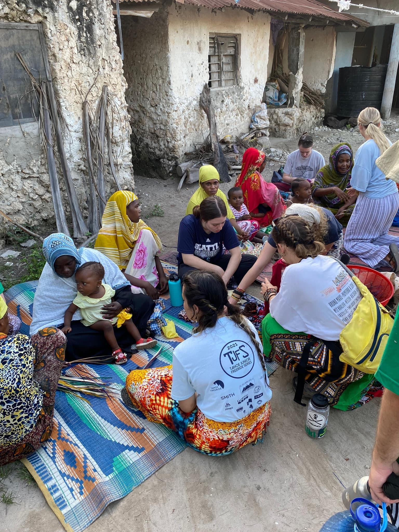 Weaving bracelets with the local women in the village