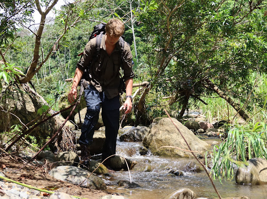 Trekking through a jungle river