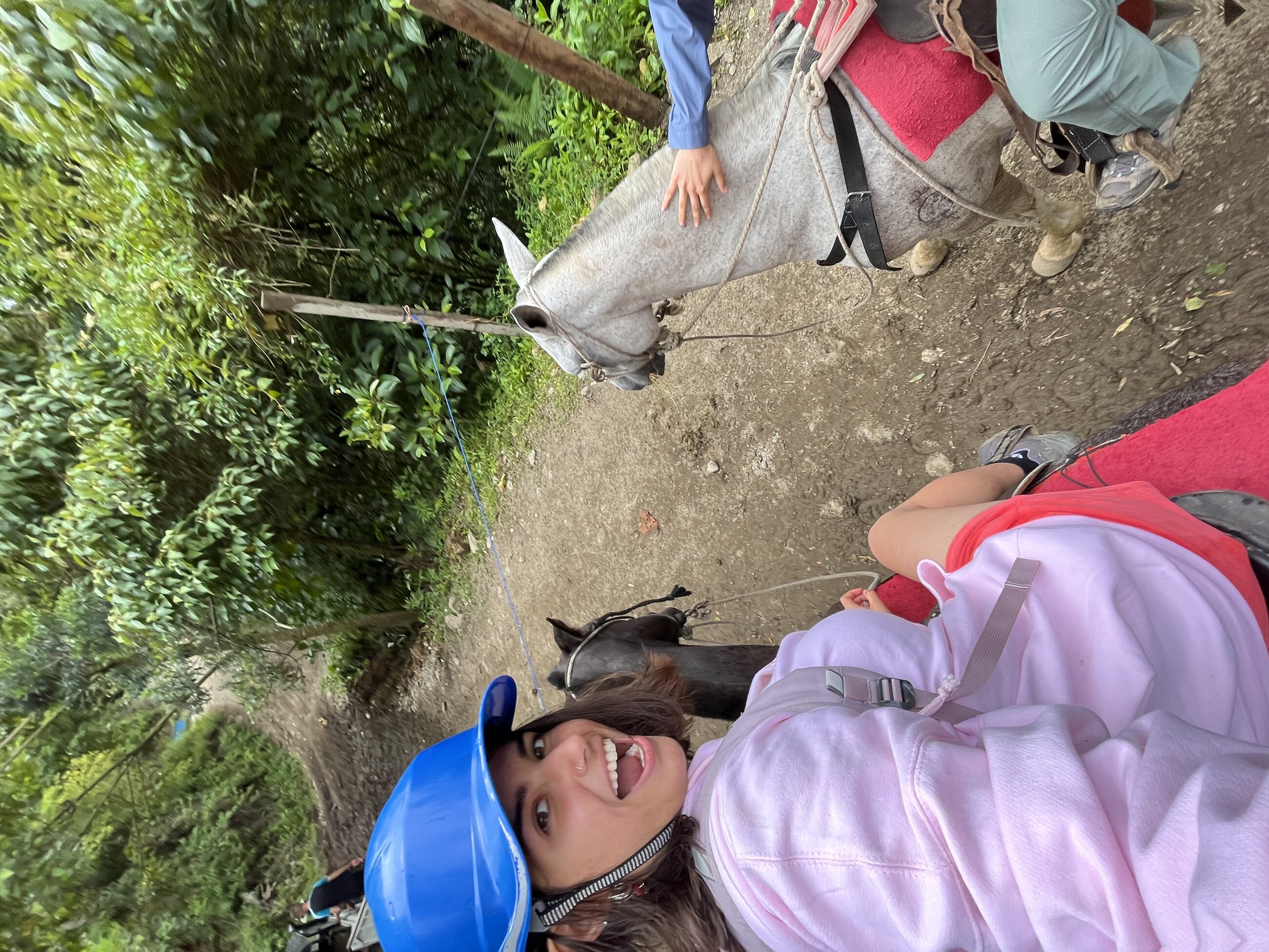 Me riding a horse after hiking through the beautiful waterfalls of Monteverde.