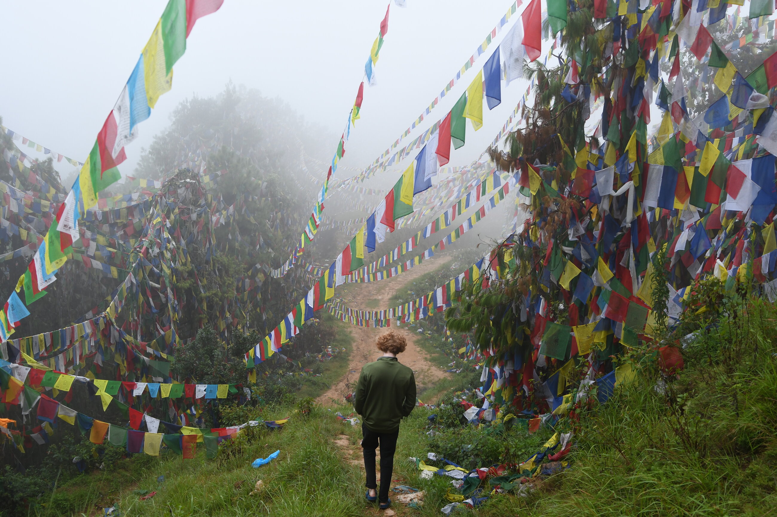 Trip Participant Walking at a Buddhist Monastery
