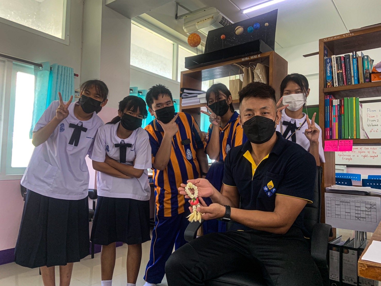 Students giving Phuang Malai (Floral garland) as a sign of respect.