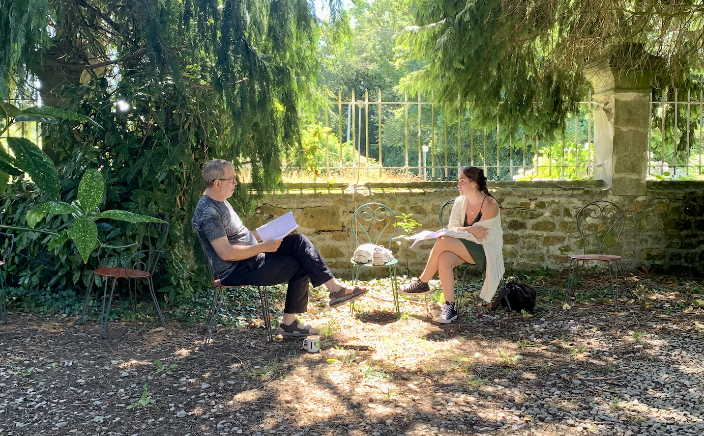 A teacher and student rehearsing lines for a short film scene. 