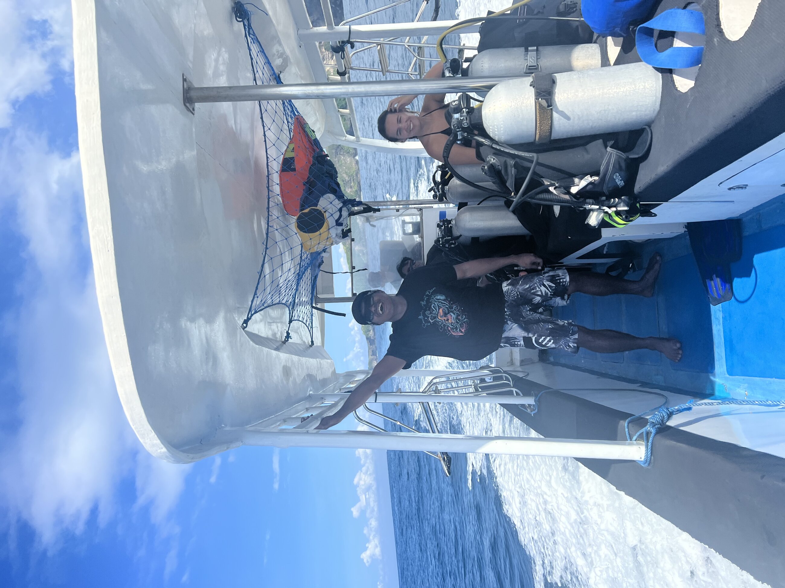 Happy dive guides on the boat
