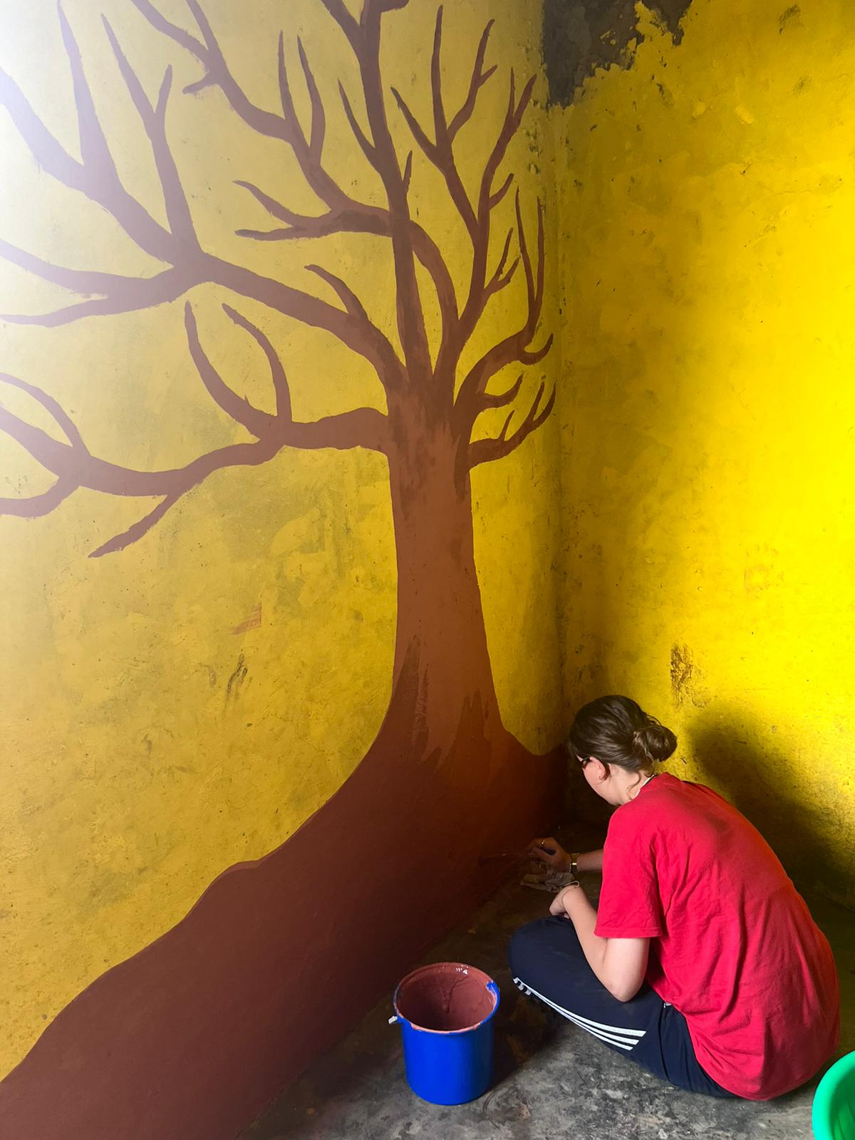 painting a big tree in the school