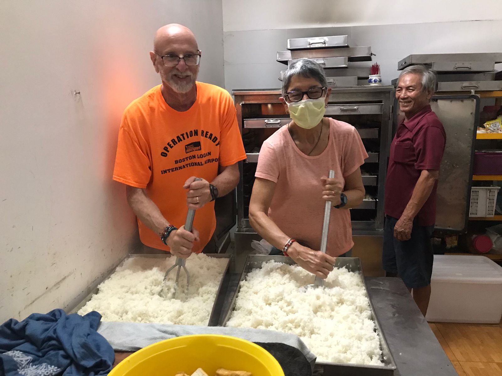 Marital Teamwork - Raking rice to prepare for serving later