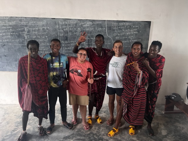 Me (white shirt) with my co-teacher Jeremy (pink shirt) and our students in Literacy 2