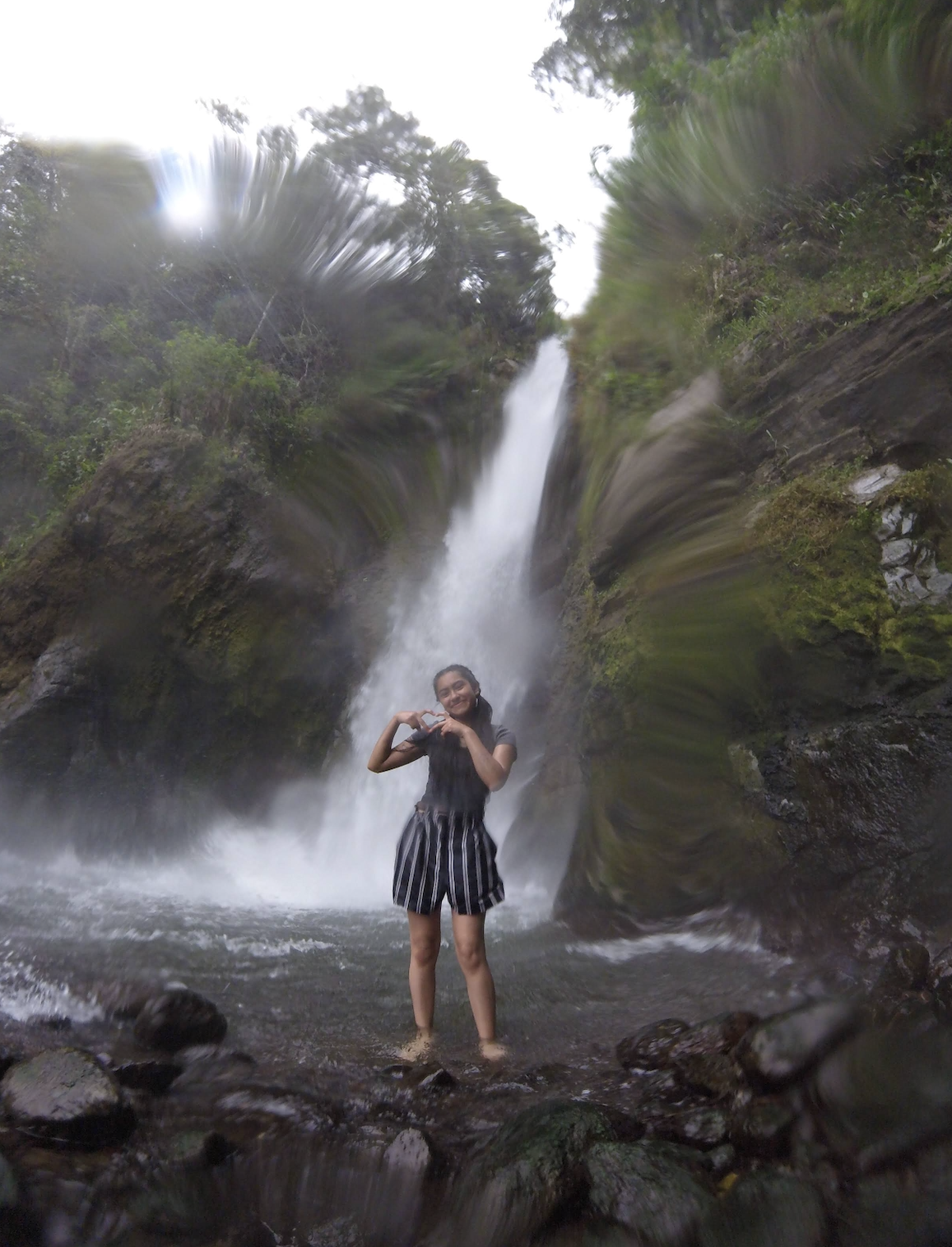 Me in front of a beautiful waterfall we visited!