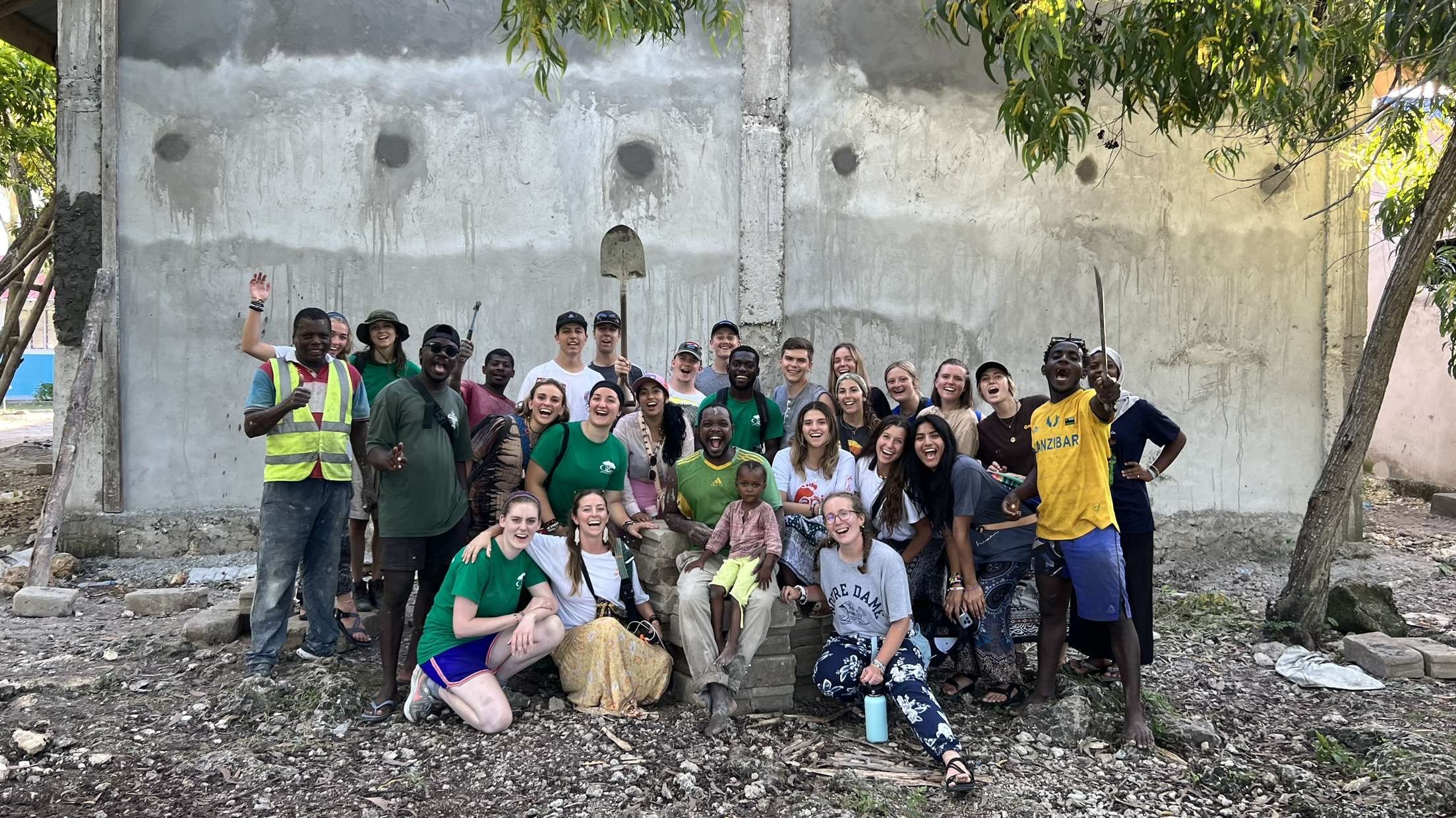 Our whole group on our last day, in front of the wall we had finished during our weeks of construction!