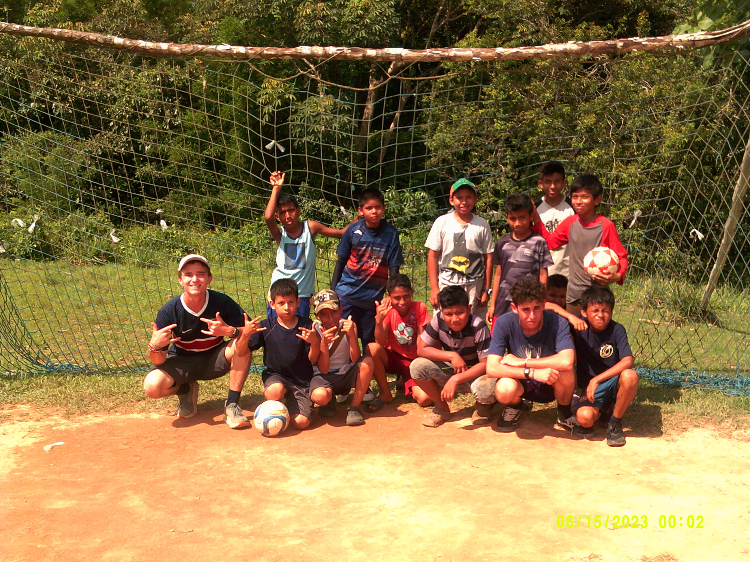 "Soccer after school with the local youth". (I'm On the left and my Partner, Reuben, Is on the right... were both white)