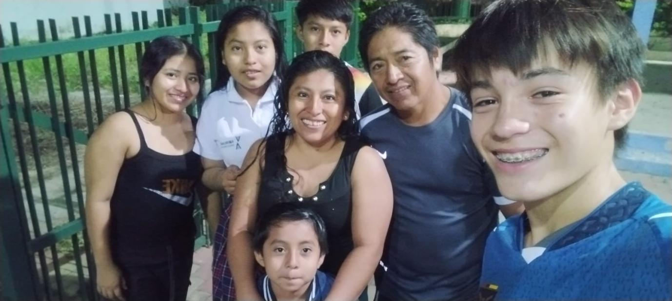 A selfie of me and my host family in the community's playground.