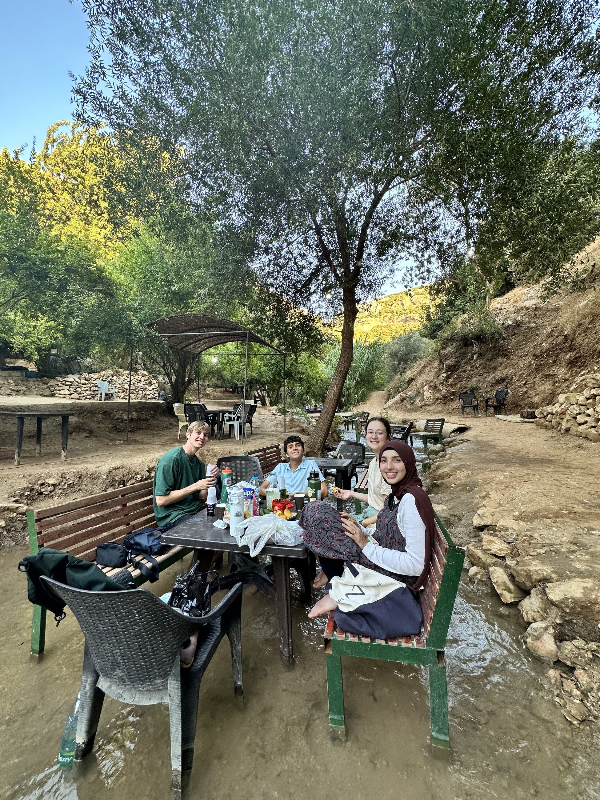 Picnicking with friends at a wadi in the north