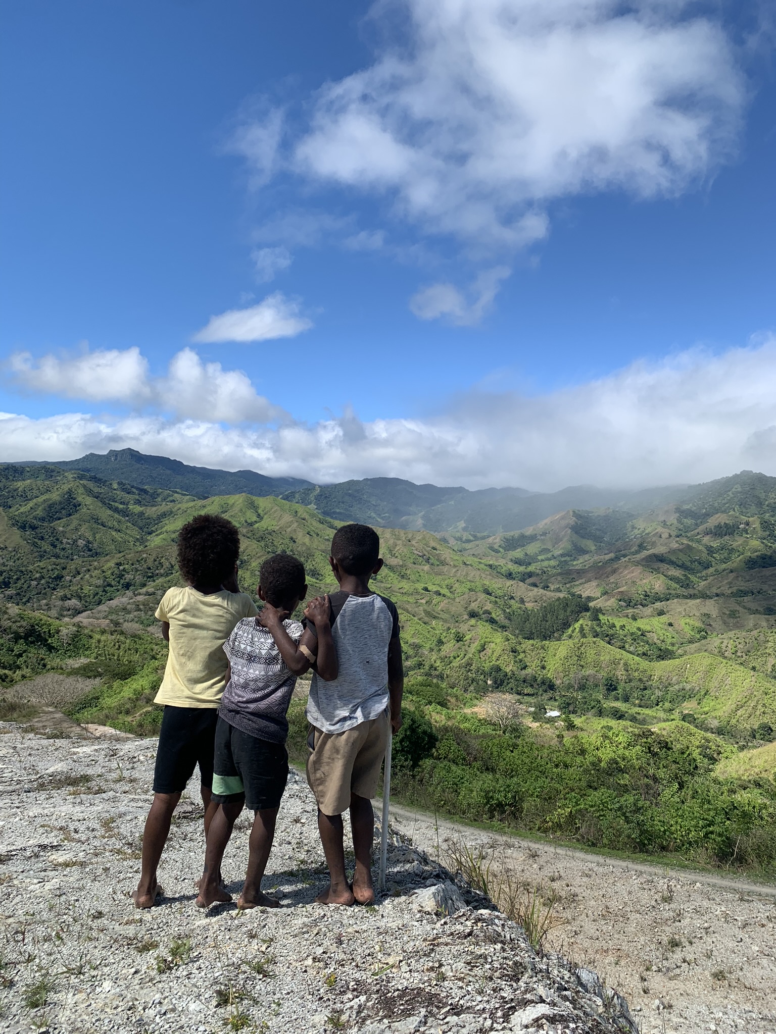 Fijian children from the village looking out over the heart of Fiji