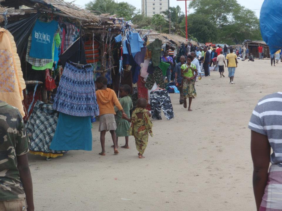 small town market in mozambique, second hand clothes.