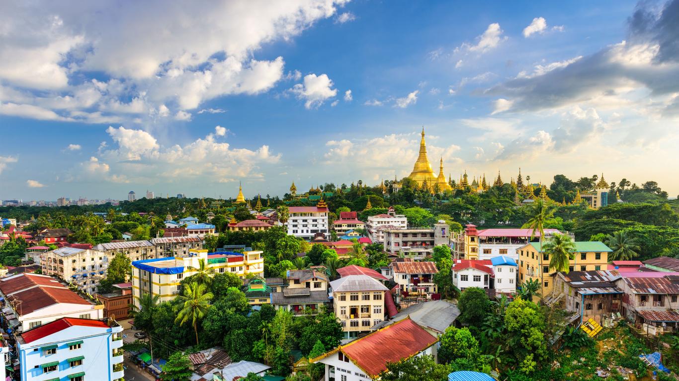 a view of Yangon with the famous Shwedagon pagoda seen in the background