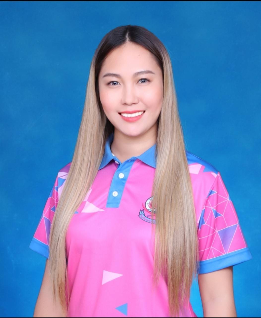 Clothes: School Top with logo.