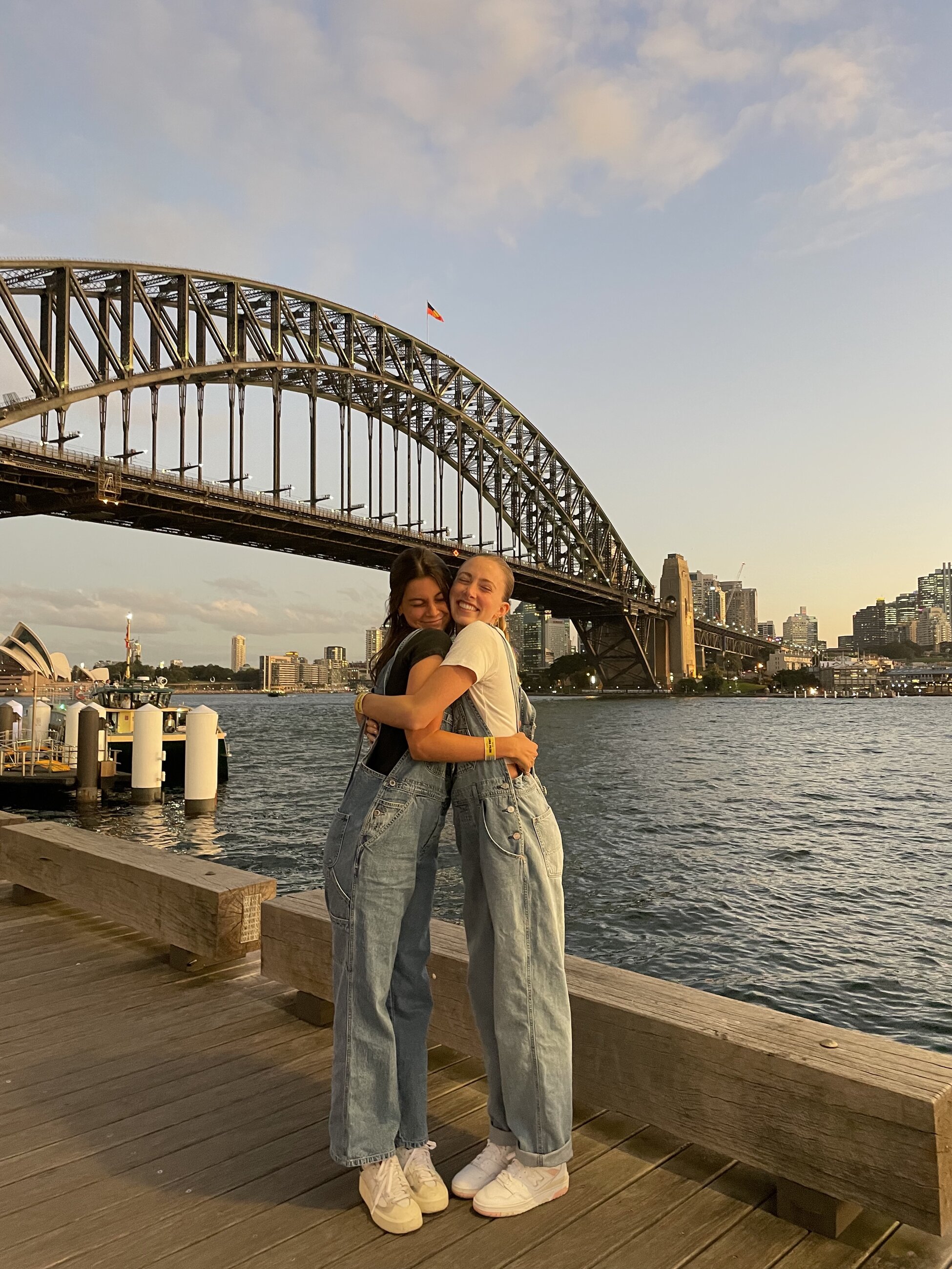 Enjoying views of the Harbour Bridge and Opera House with friends