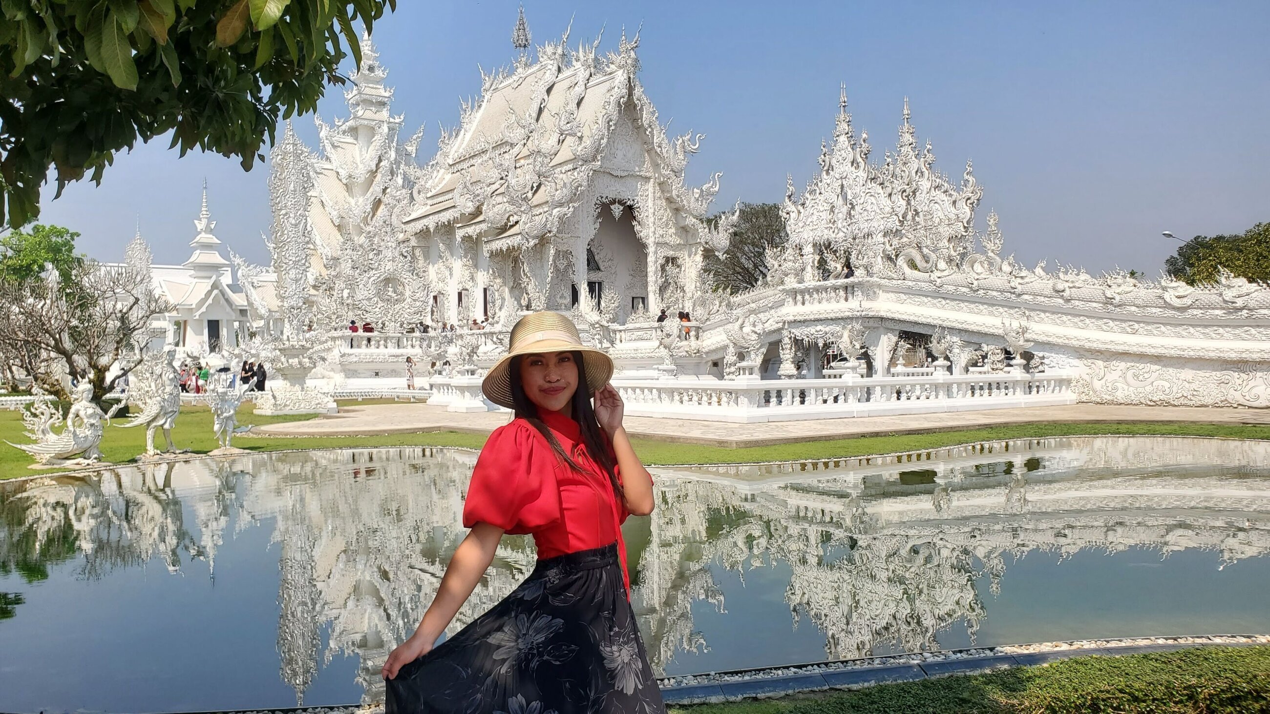 Tia Moua at Wat Rong Khun temple in Chiang Rai, Thailand.