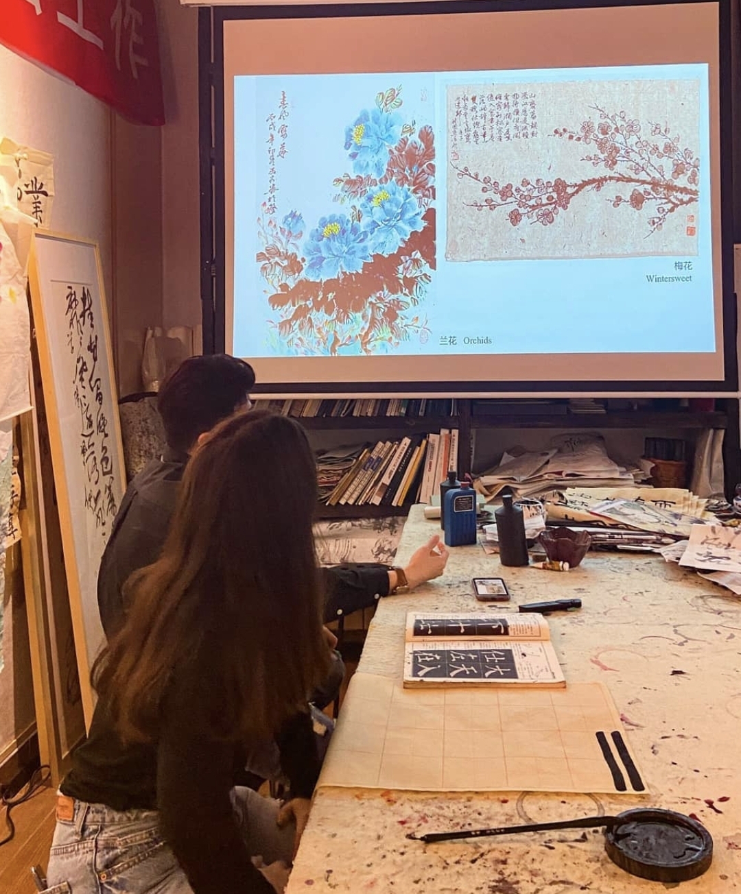 Taking a Chinese calligraphy lesson, one of the free cultural activities provided by the program.