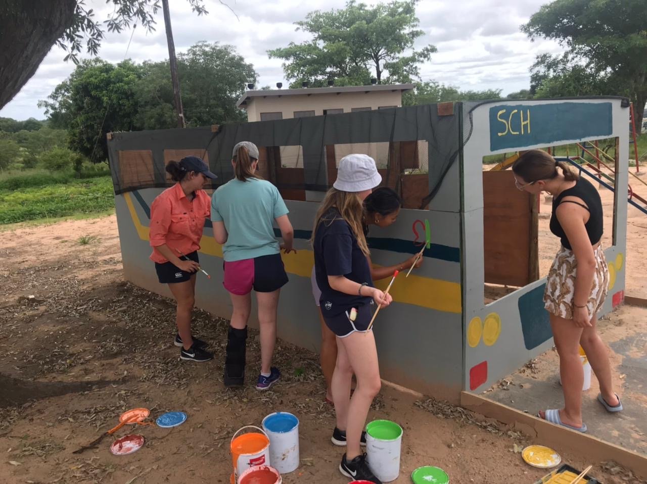 Outreach - painting a playground bus for local crèche.