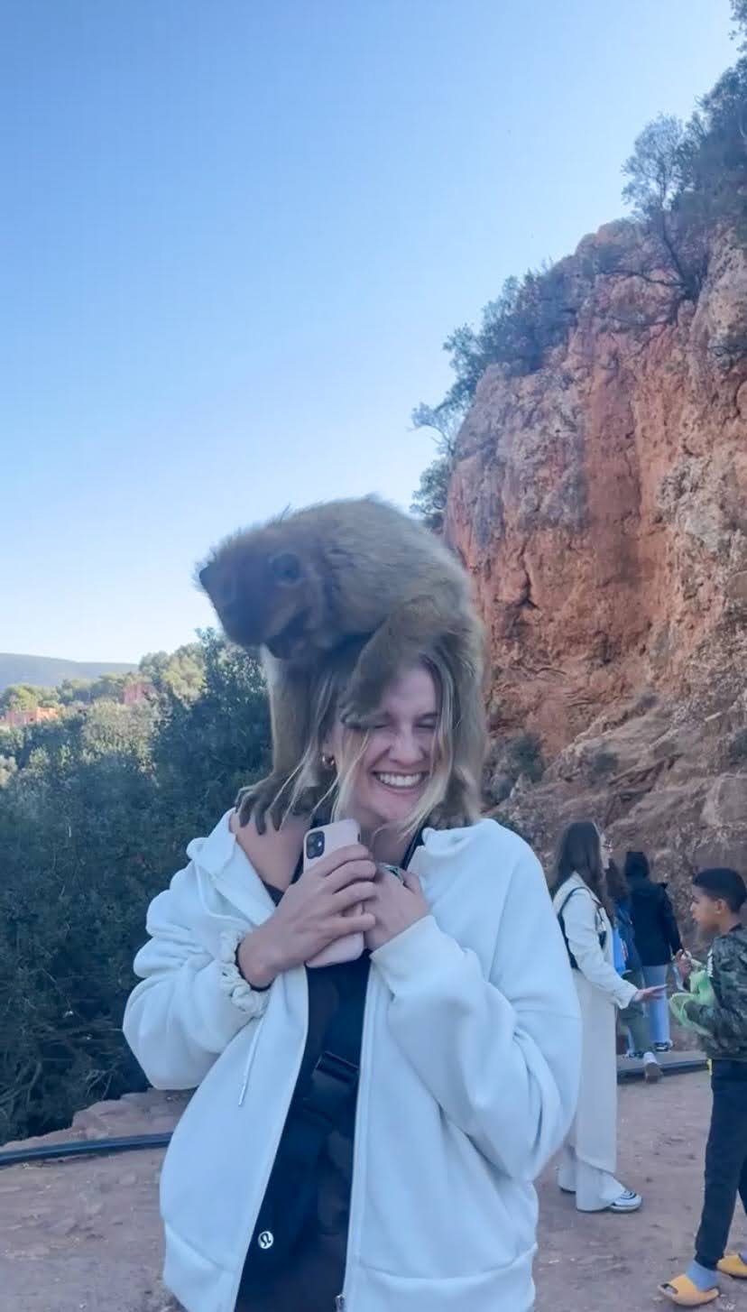 Monkey climbing on my head in Morocco