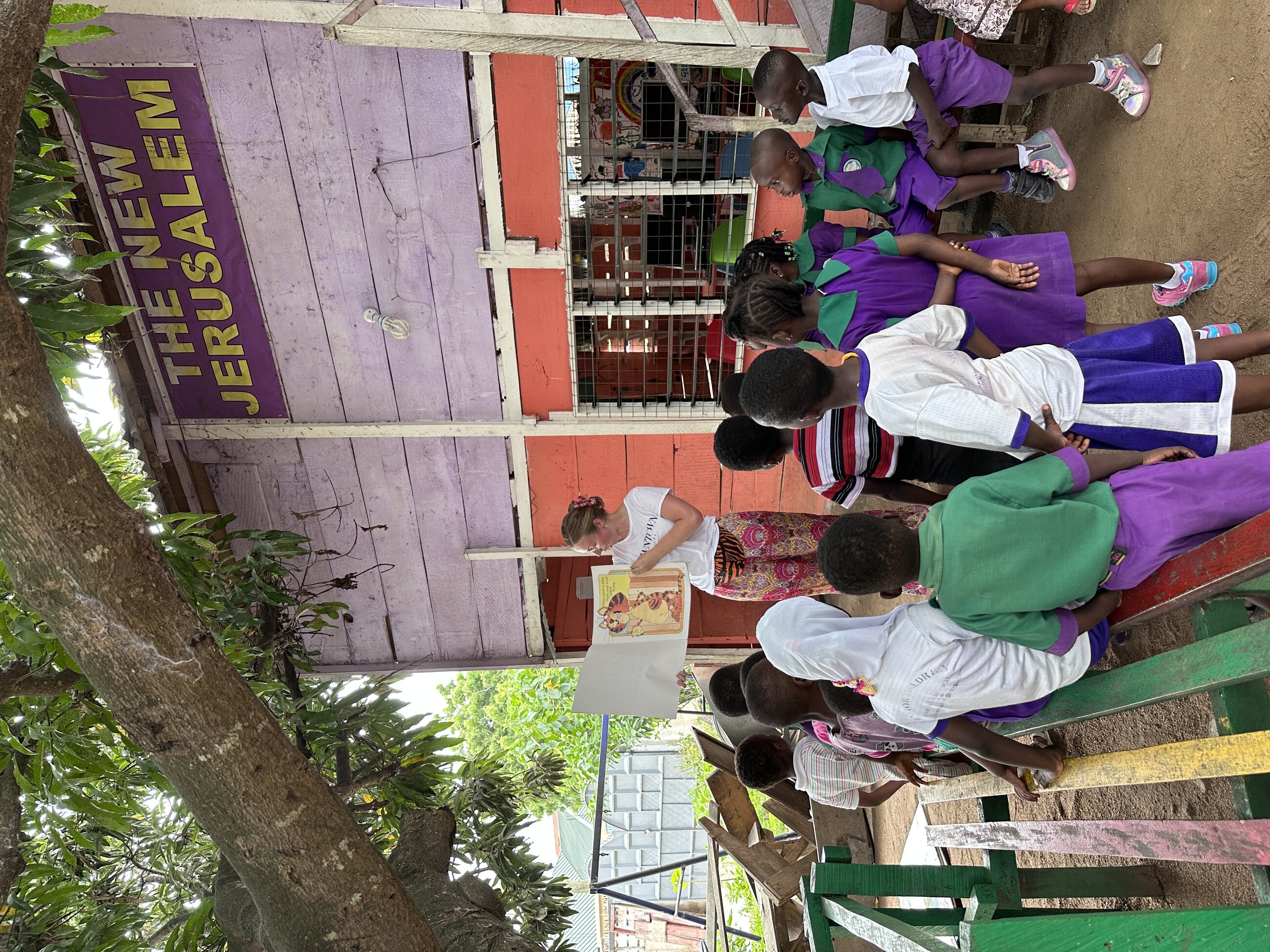 Reading a book at the orphanage