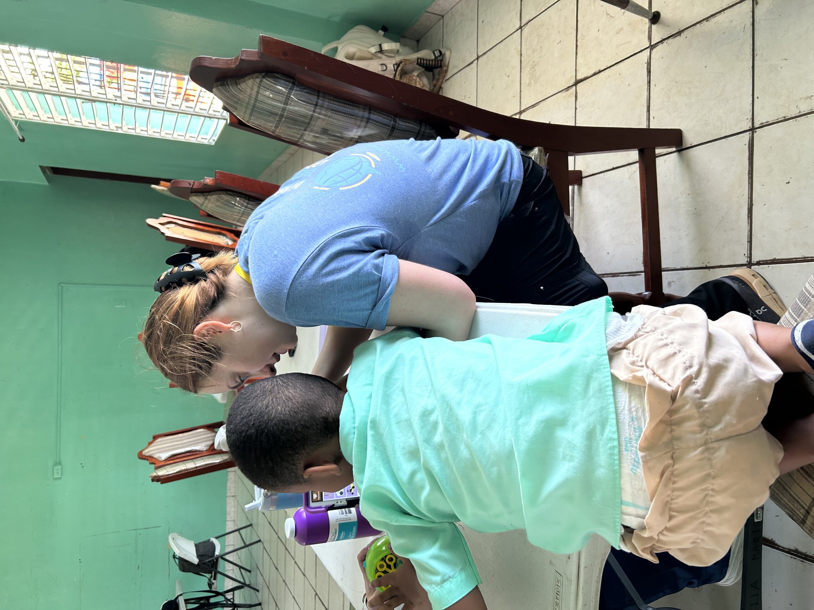 Working with student at Stella Marris School in Belize City