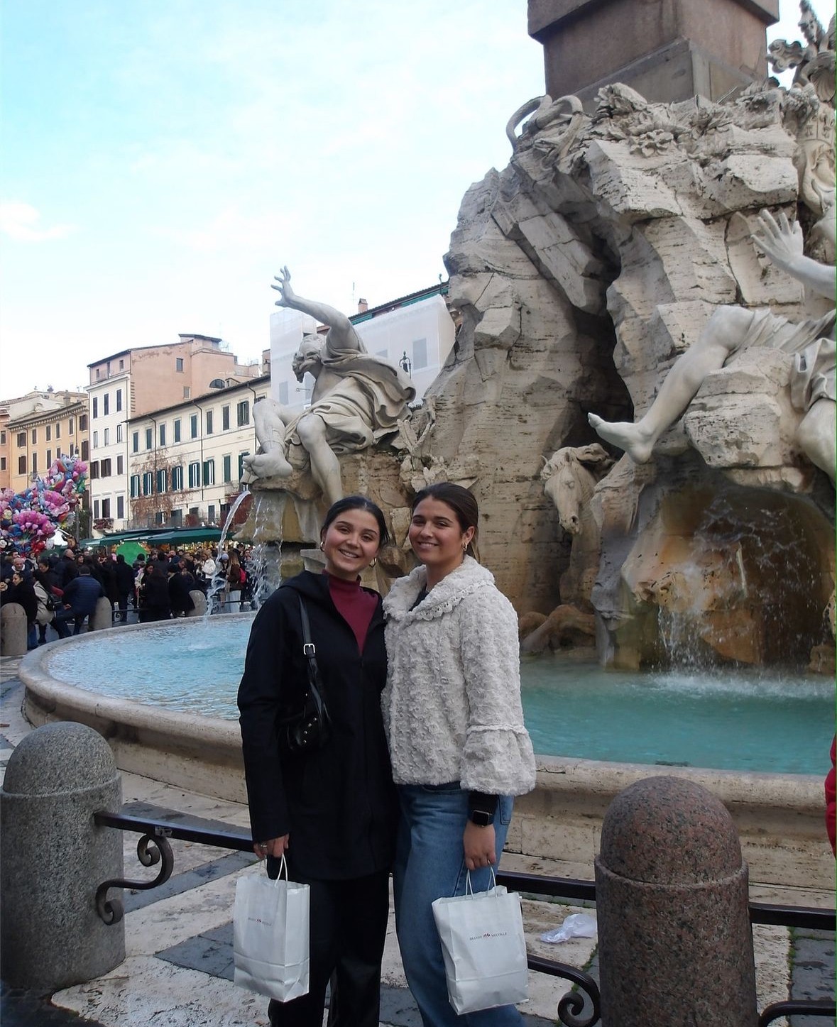 My friend and I in front of a fountain after attending Mass said by the Pope!