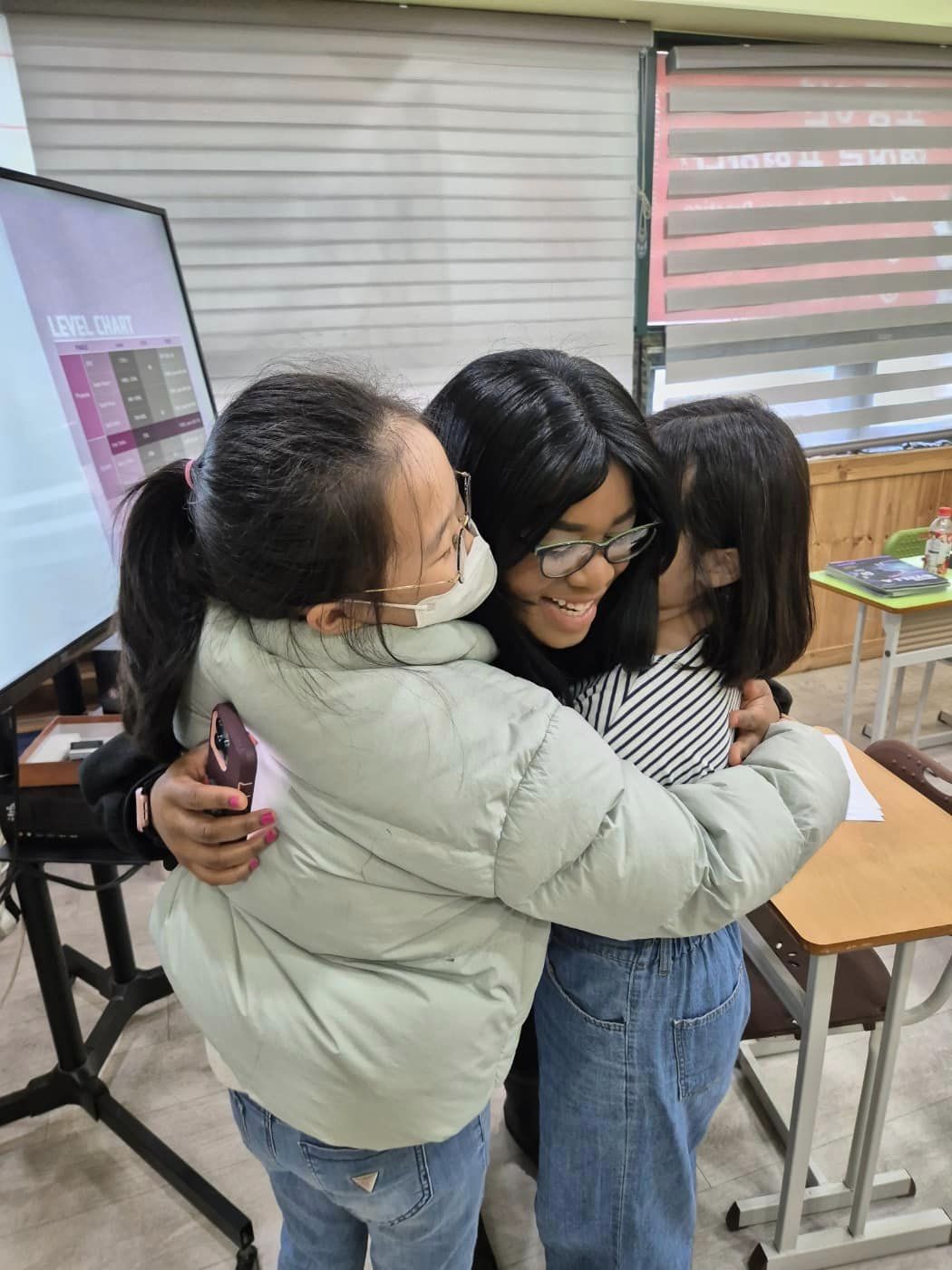 Hugging my students after they surprised me with a cake for my birthday!