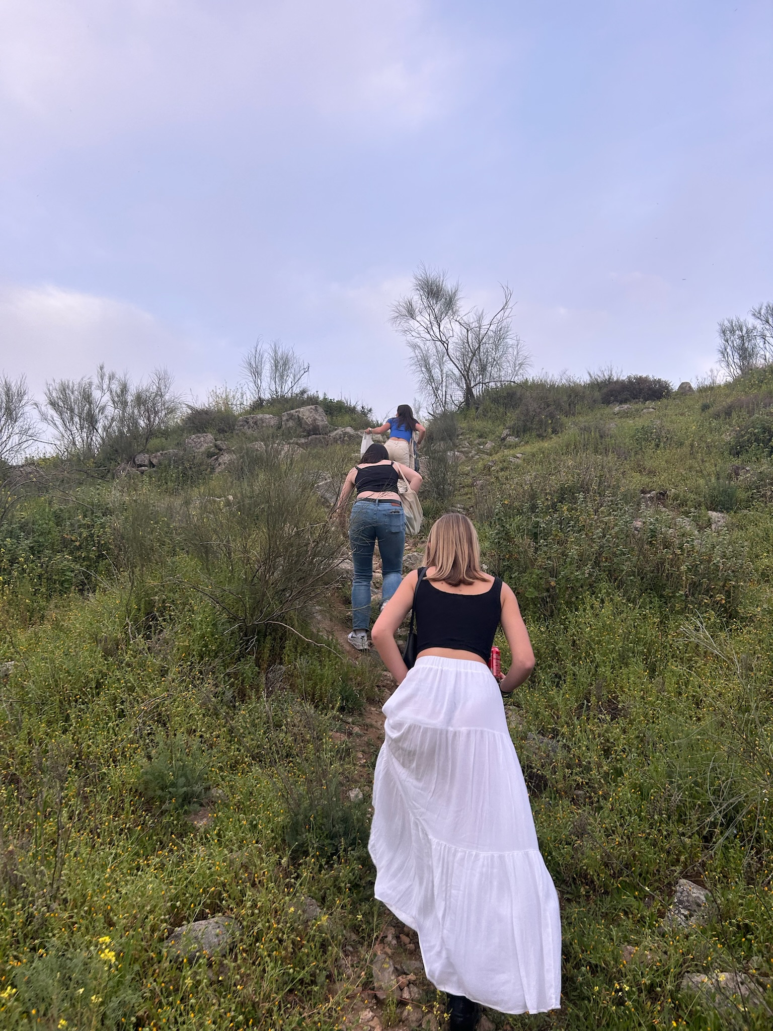 Hiking up a mountain to see the sunset over Toledo