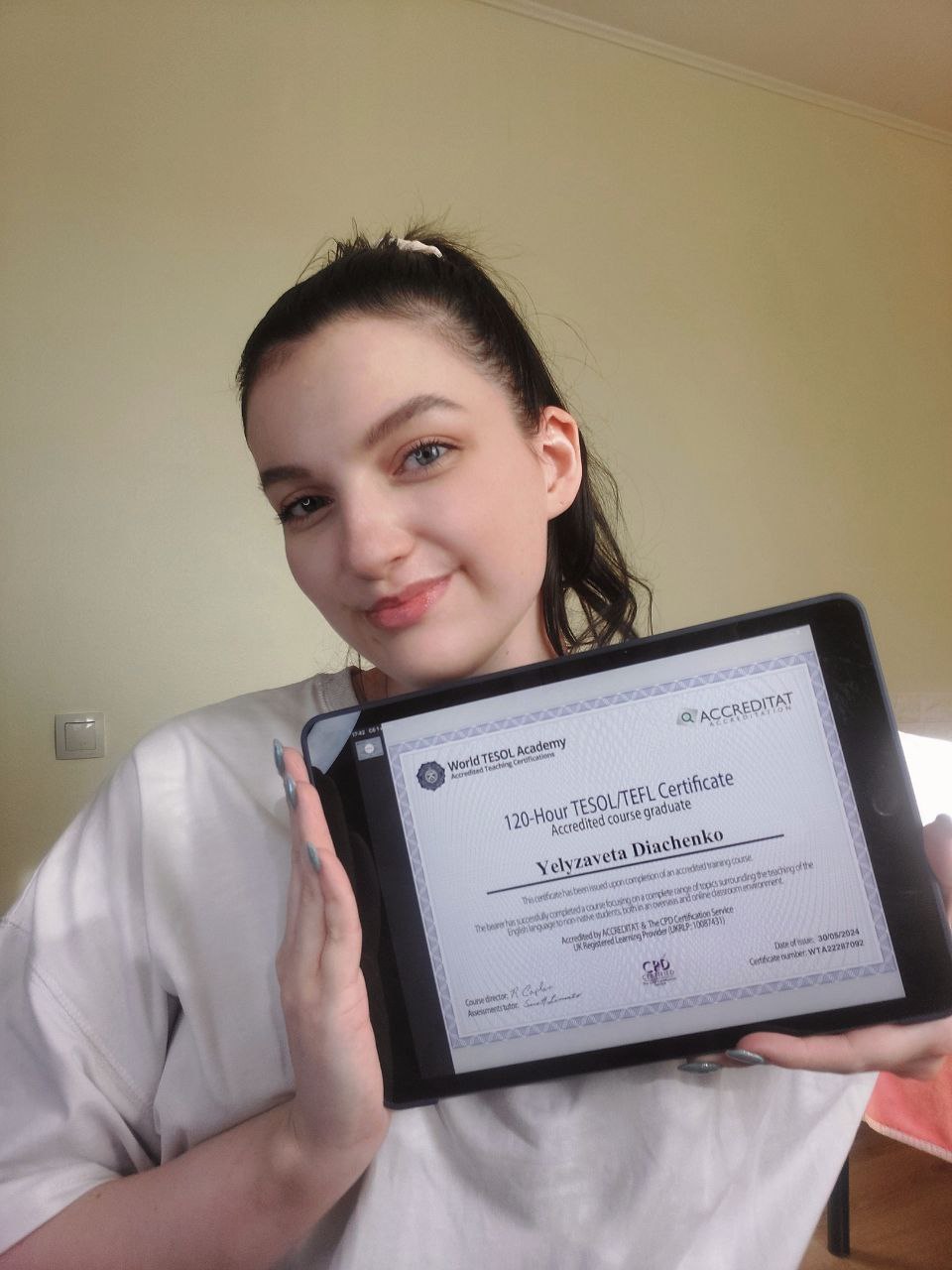 Happy owner of her first teaching certificate
