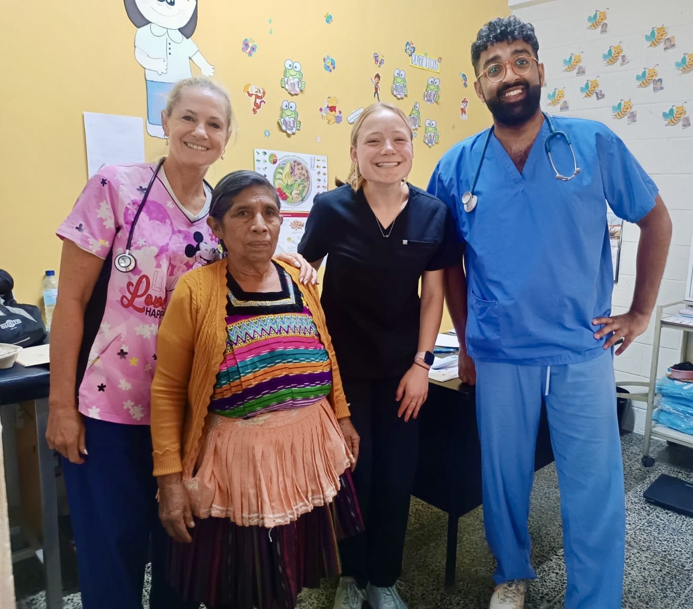 Health clinic with other volunteers and patient