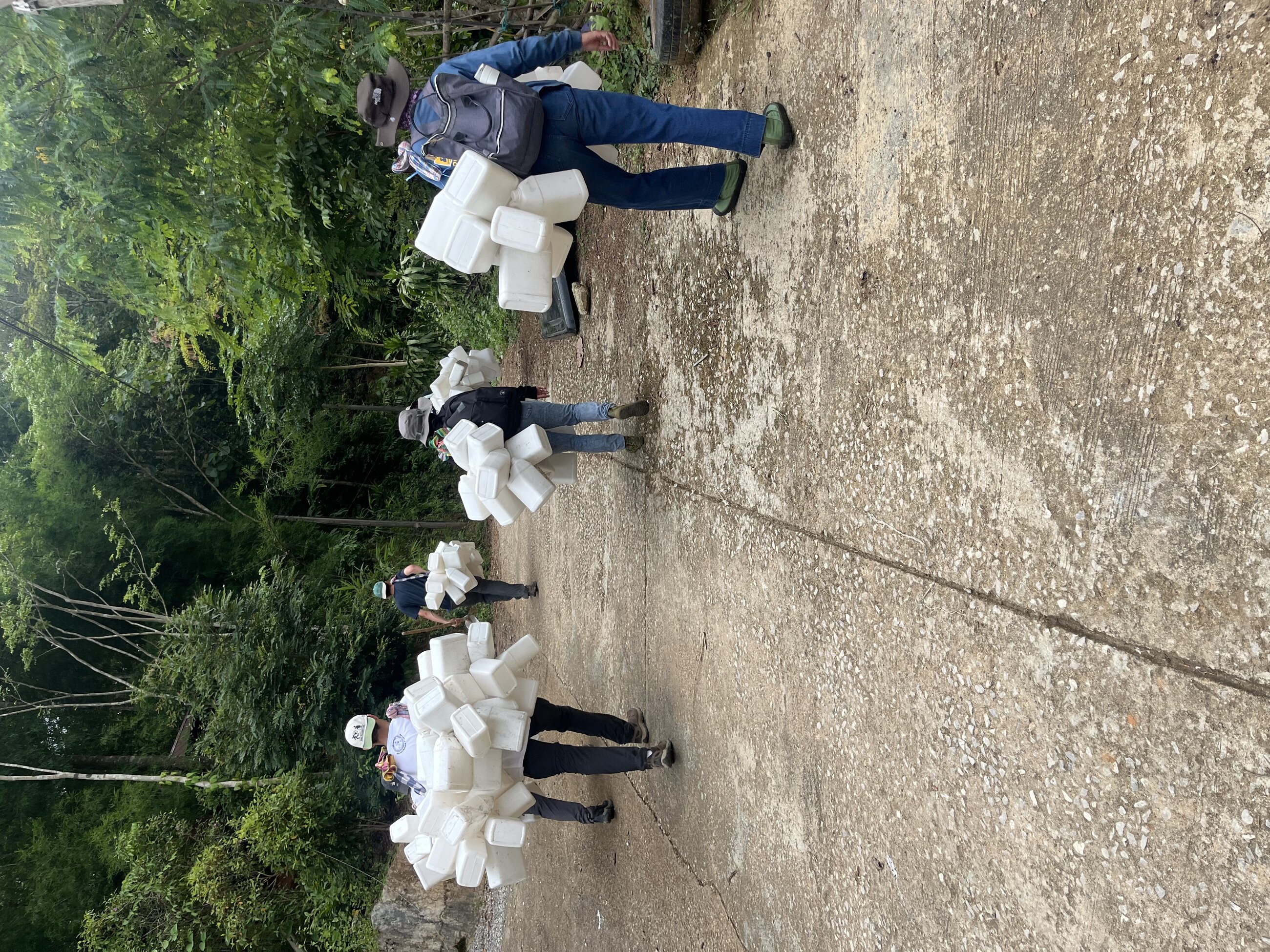 Walking into the jungle mountains to work.