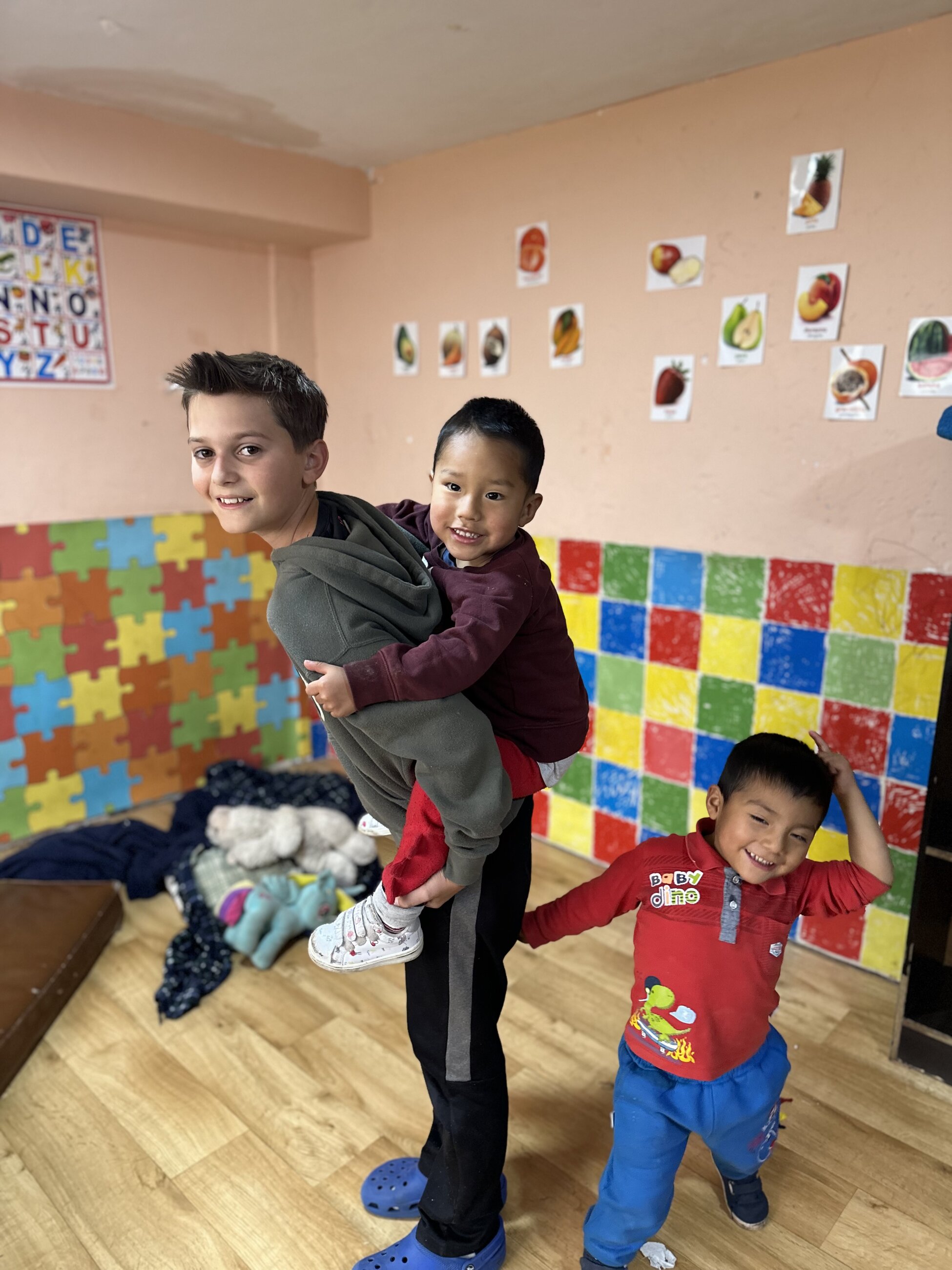 Our son playing with the kids
