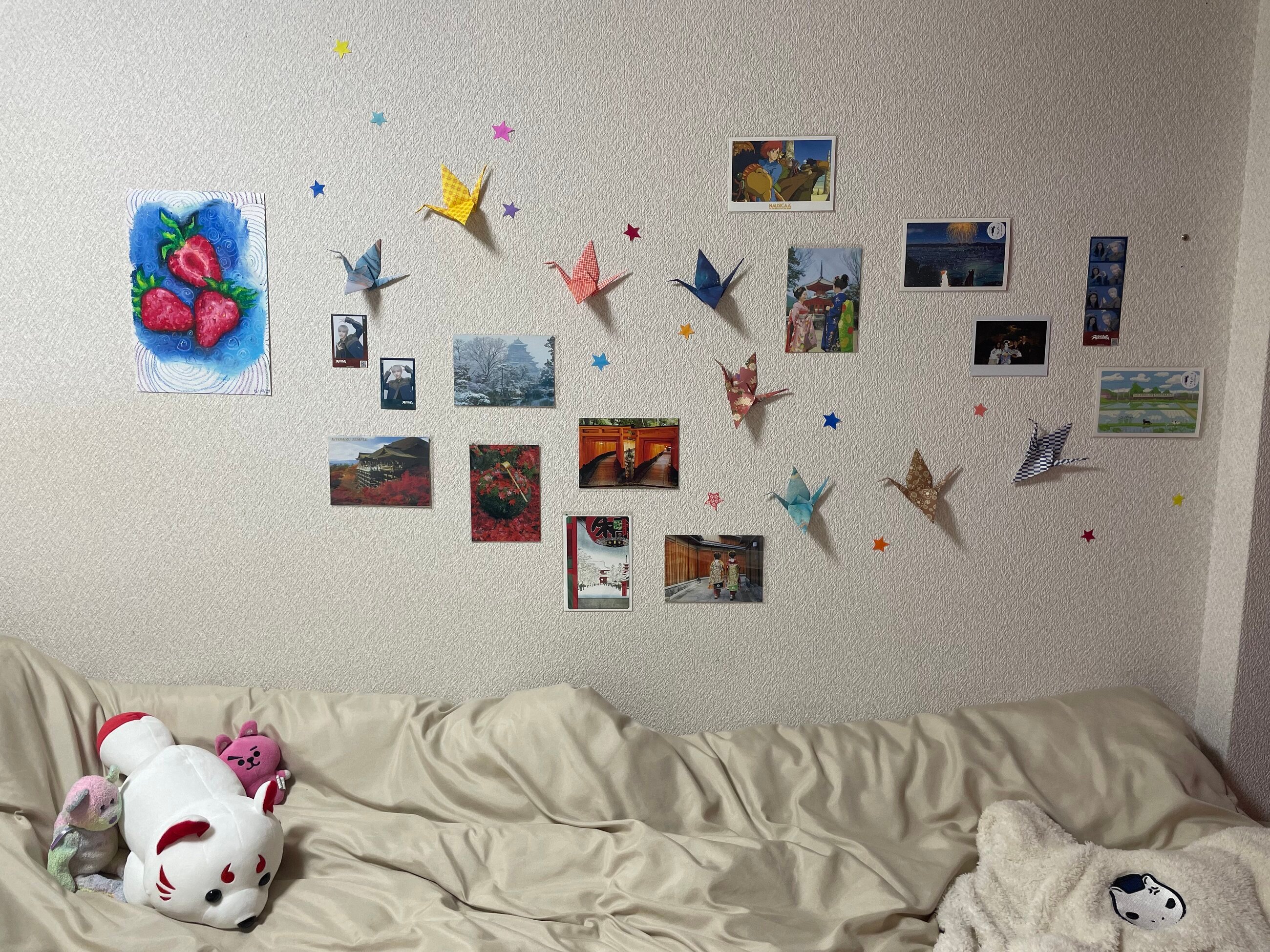 My bed and decorated wall. An example of how you can make your space your own!