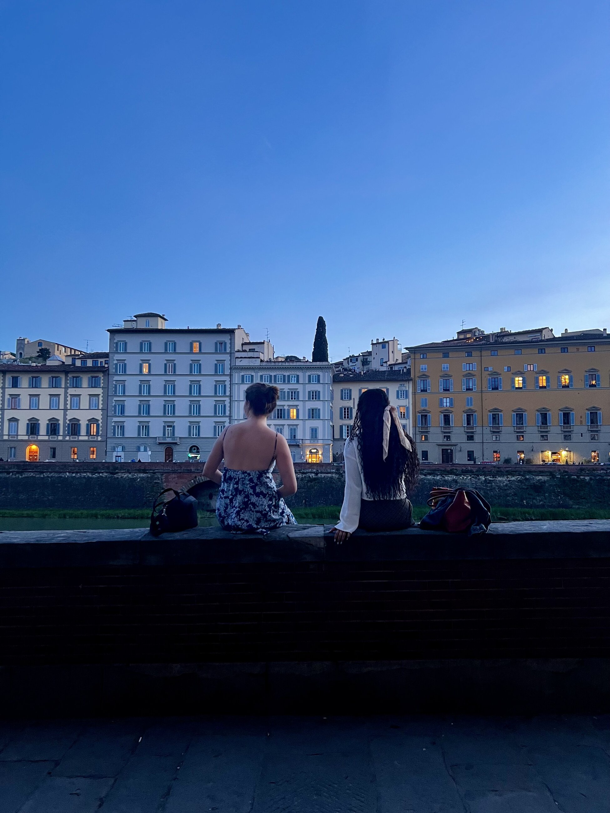Enjoying Sunset by the Arno River