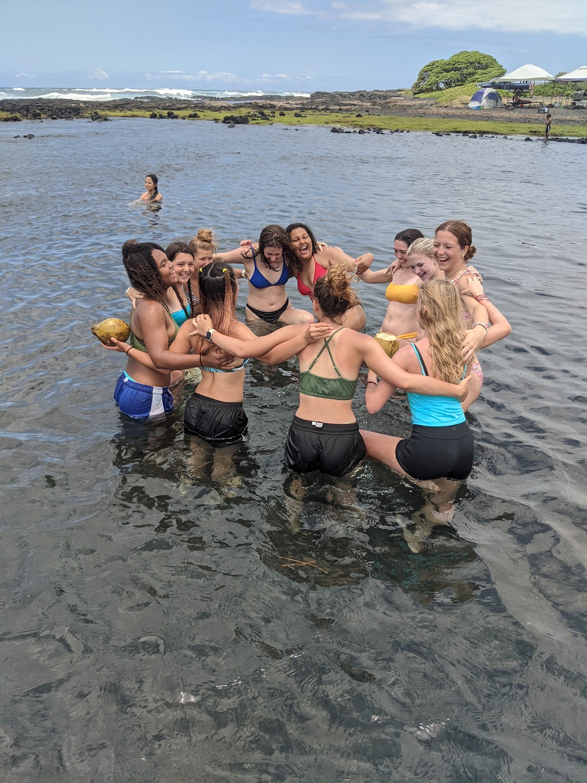 Doing yoga by the beach in the water 
