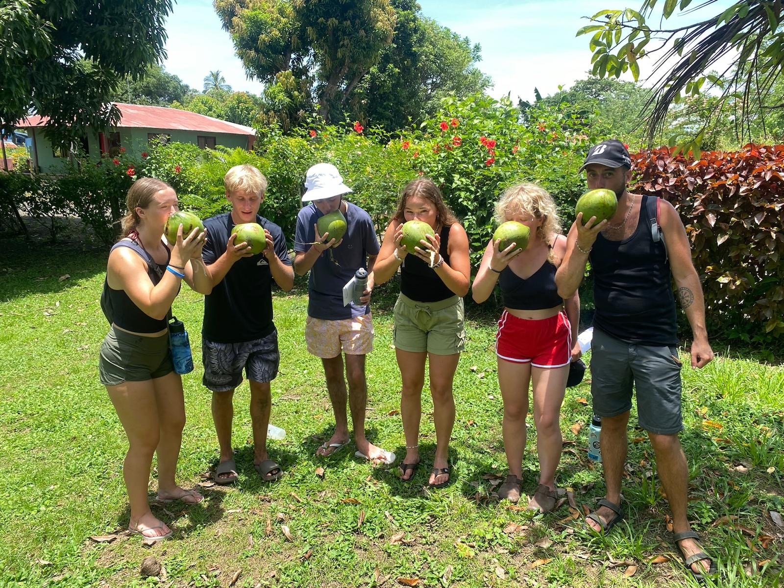Trying a coconut