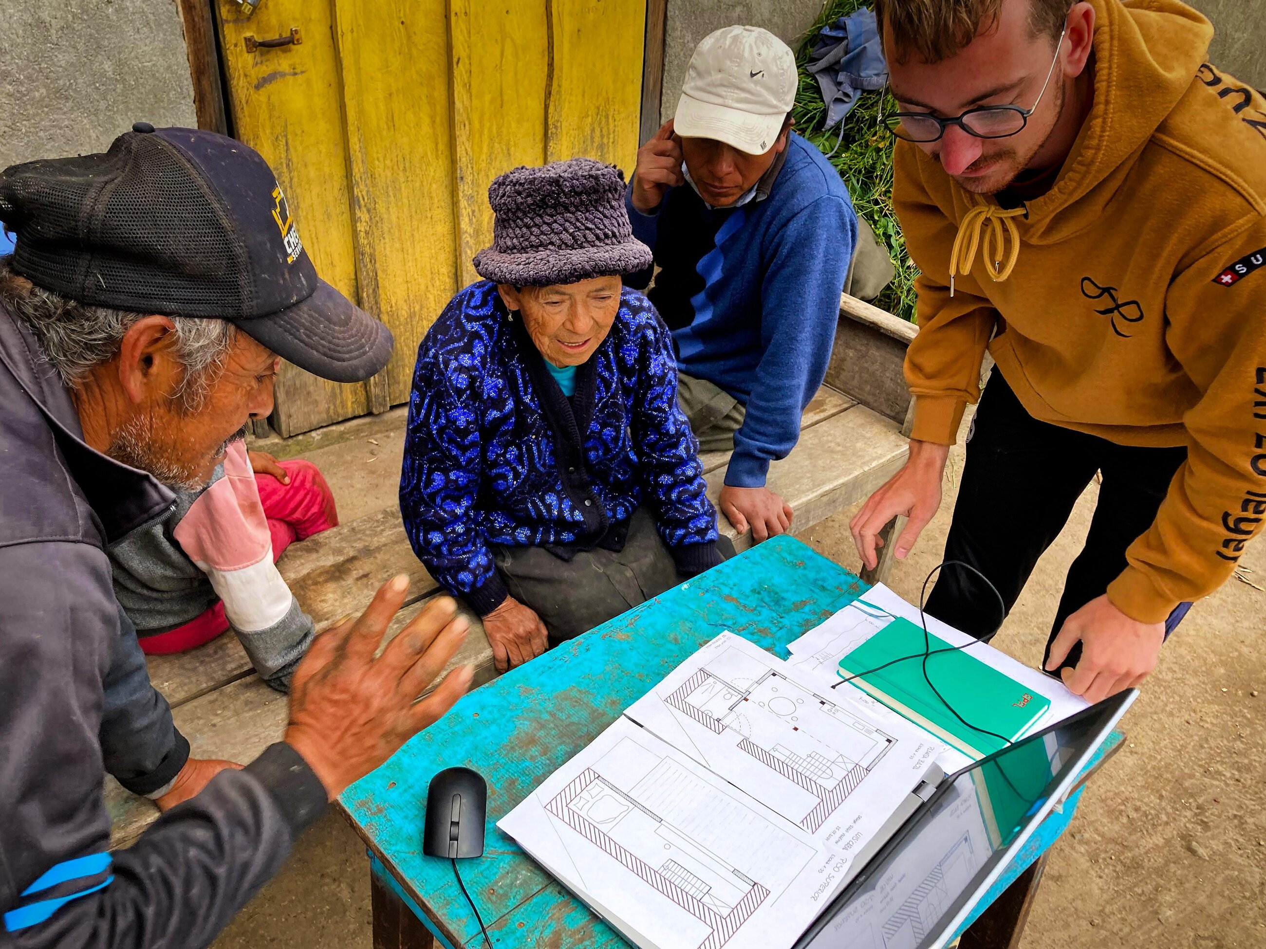 Showing building designs to a local family