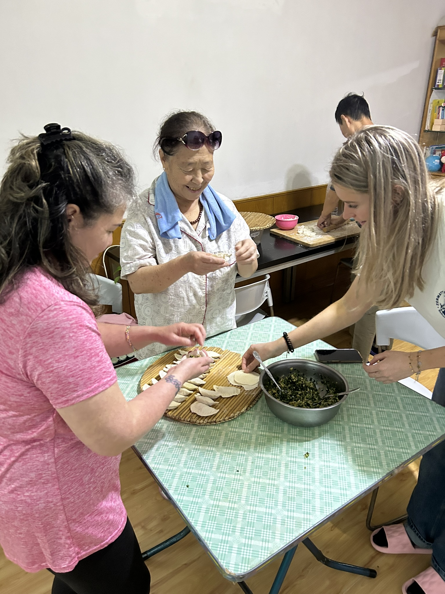 Making dumplings at Volunteer House with our host