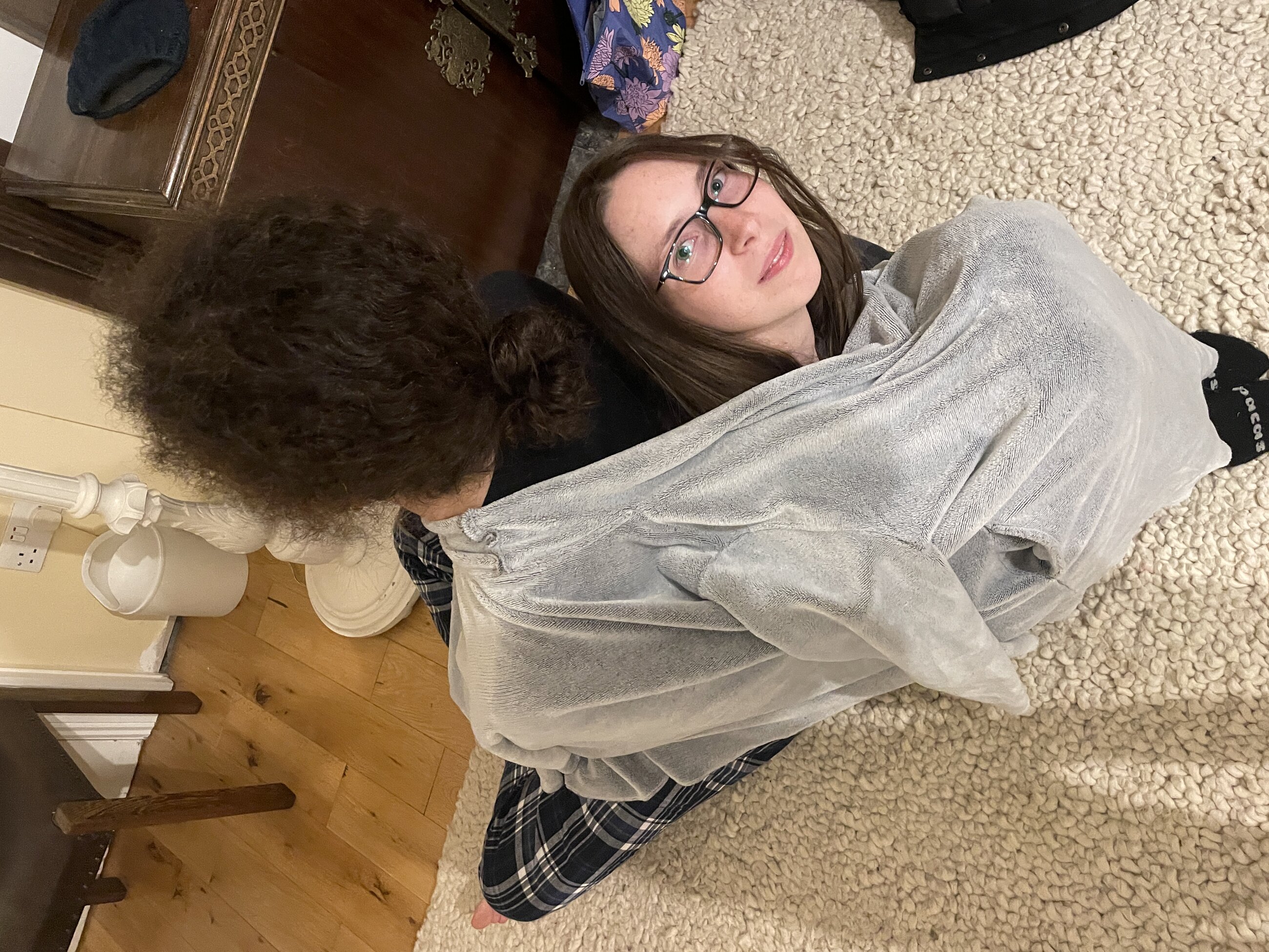 My friends wrapped up in a blanket