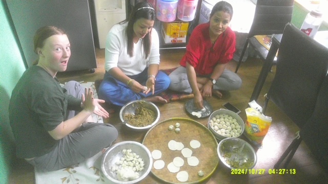 Making momos under the guidance of my homestay mom, (right) and homestay aunt. 