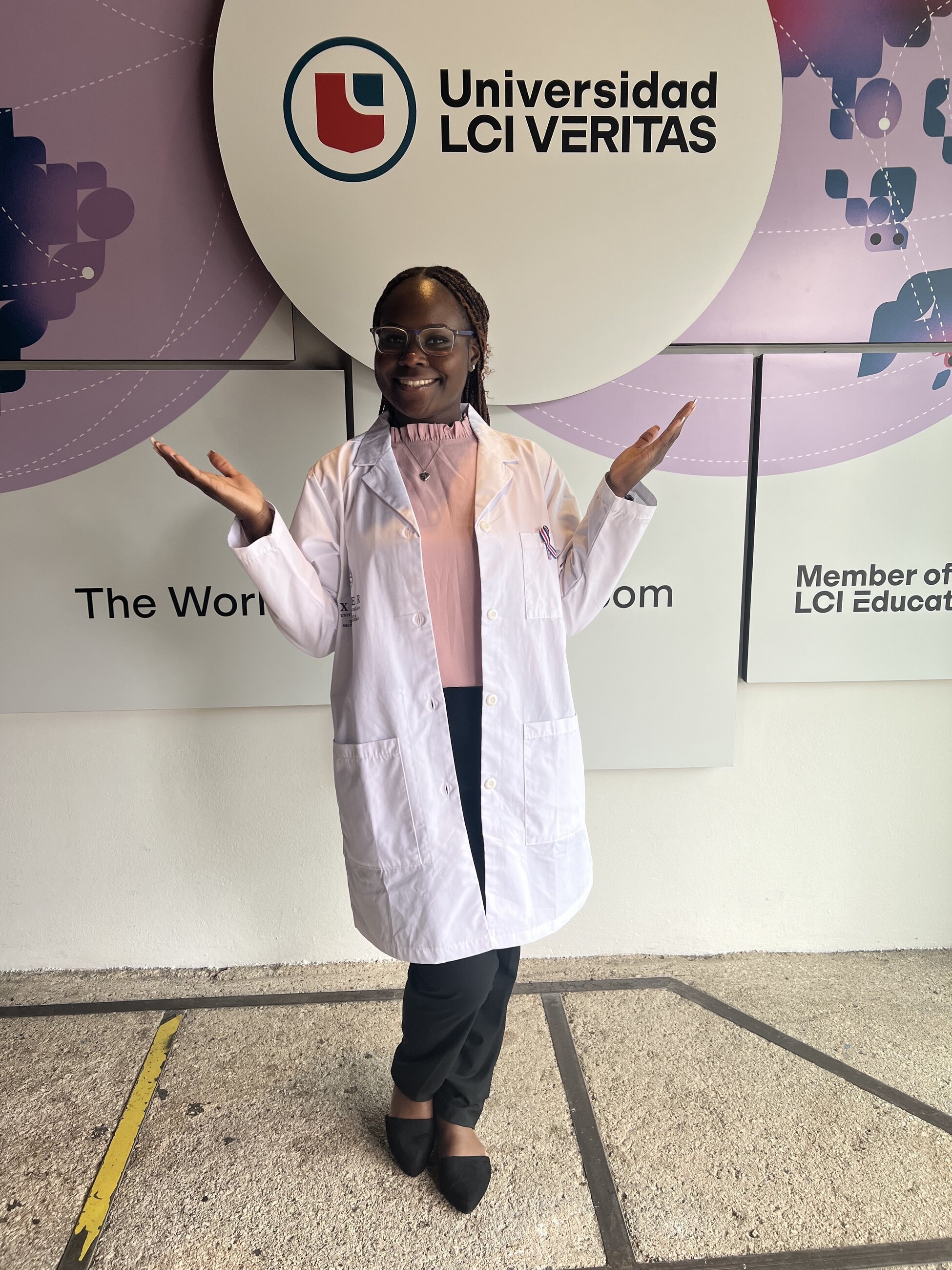 A picture of me at my host university preparing for class after just shadowing the ER at a public hospital.