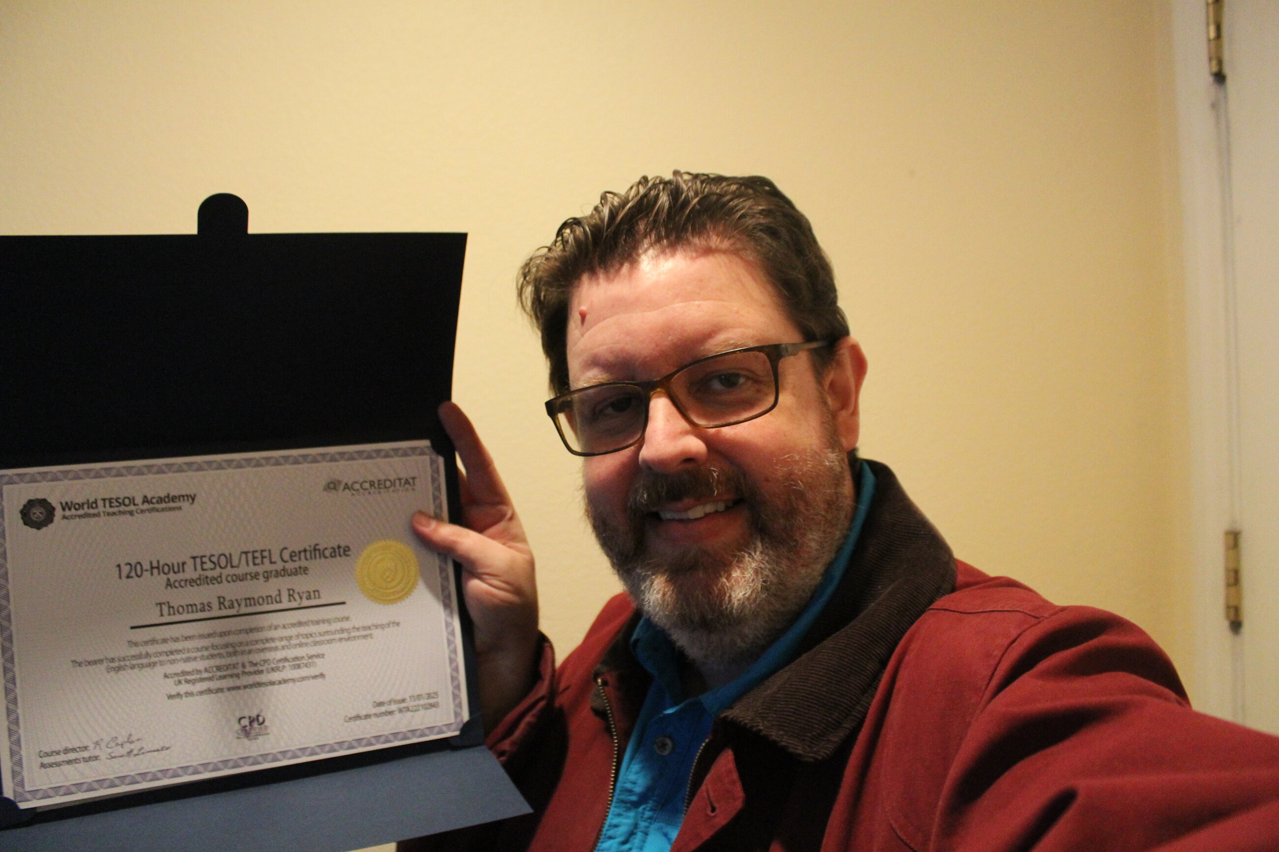 Tom with his new certificate