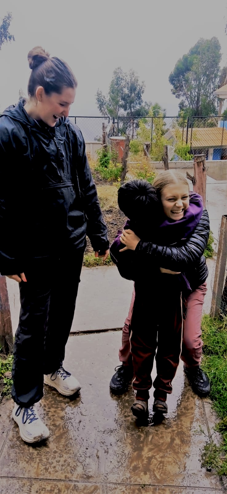 Me and my best friend I made on program with one of our new friends from a village we visited. 