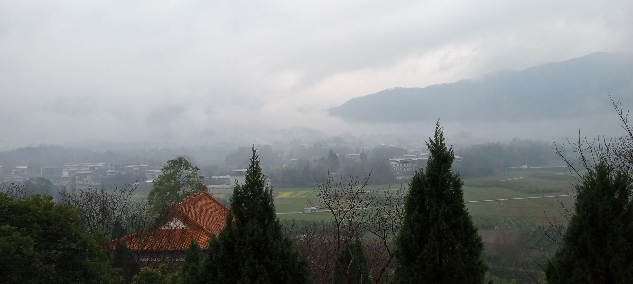View from a temple above the misty lake.