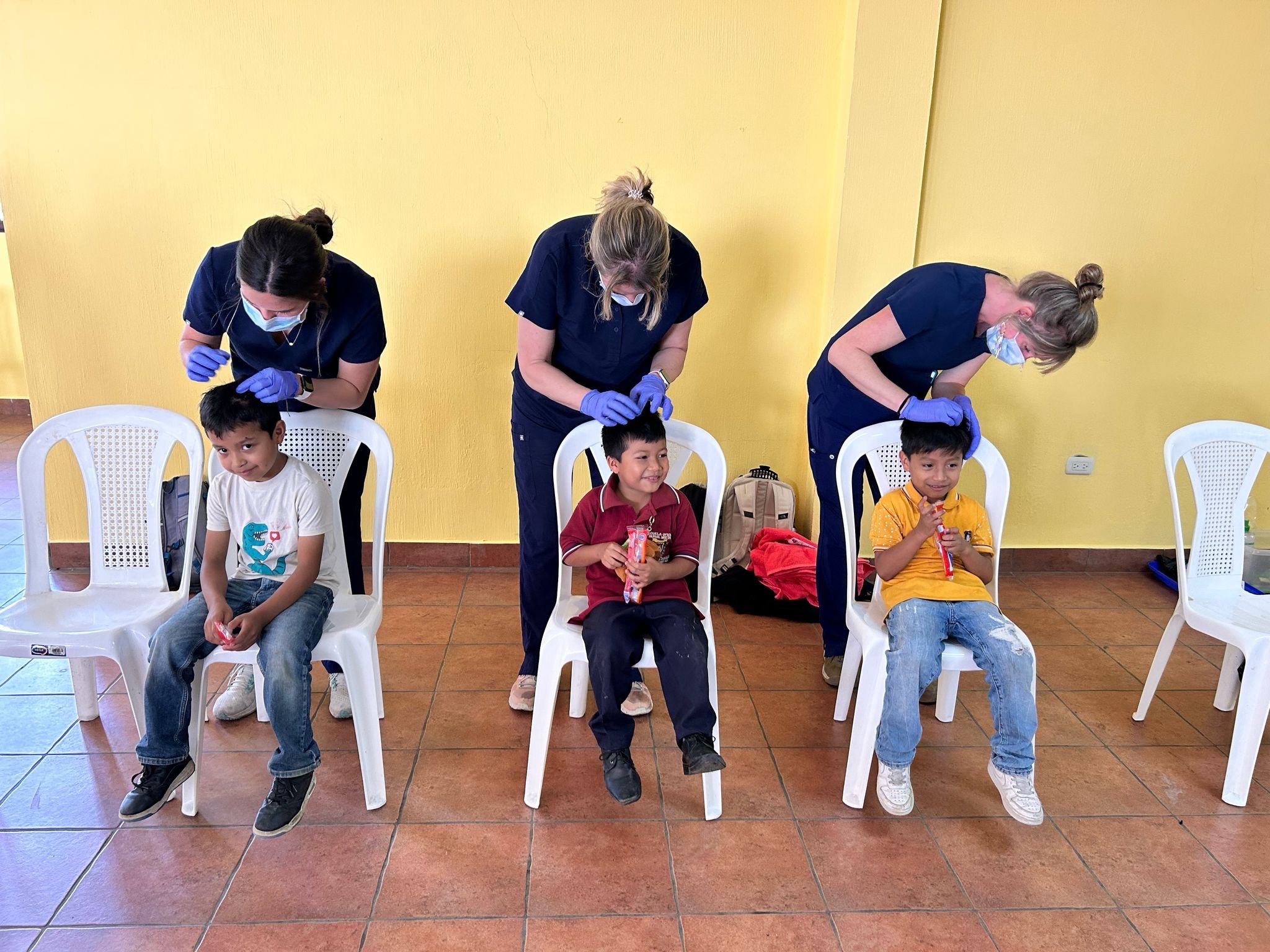 Checking children’s head for lice
