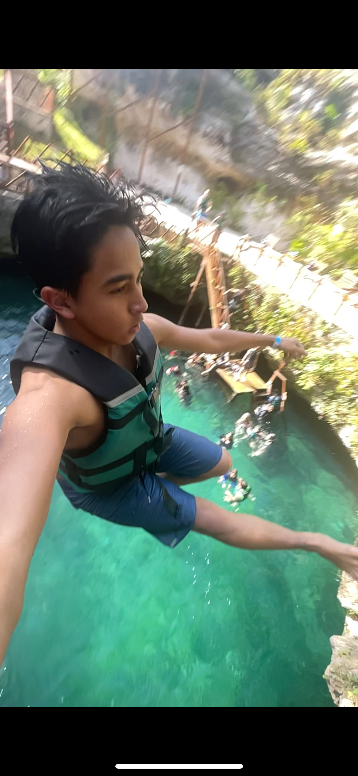 Jumping into the Sayab Kuxtal cenote
