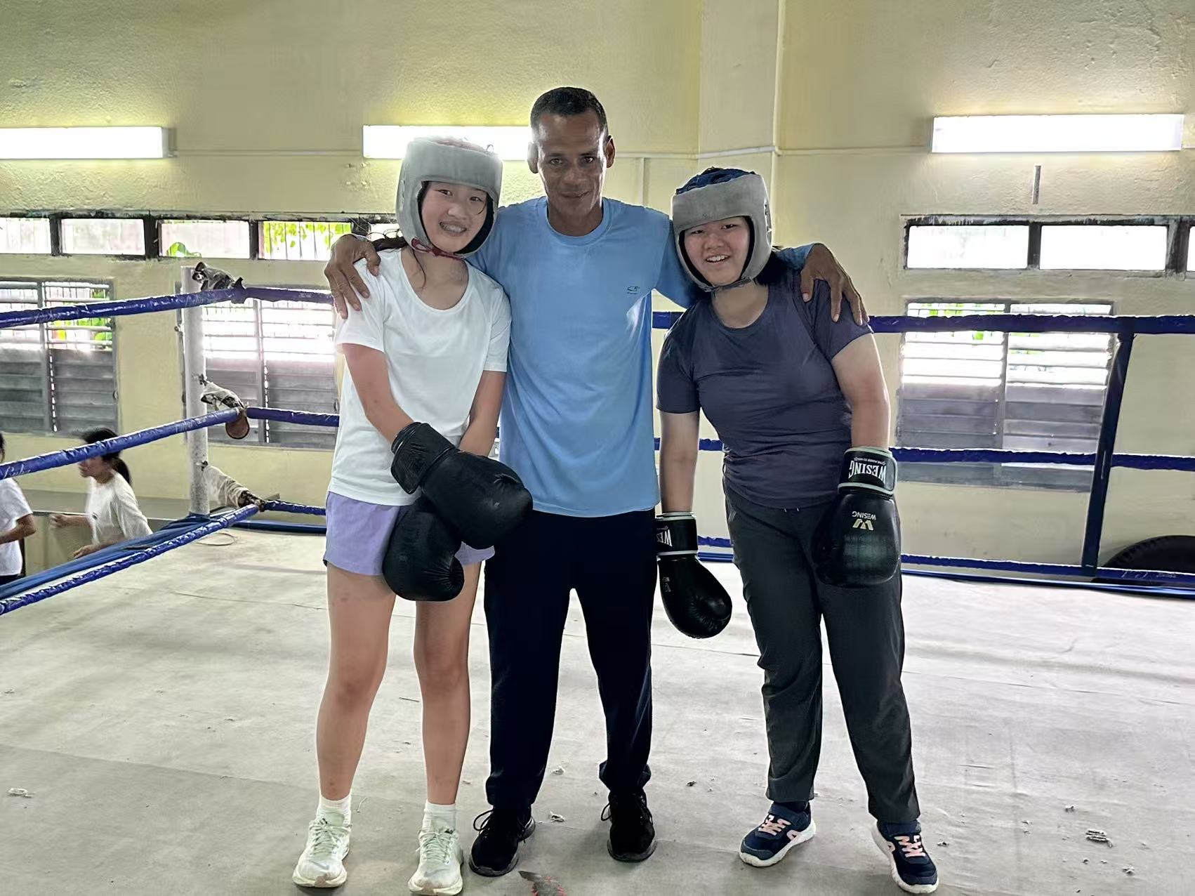 Me and Emma with coach Amilca. One of his students went on to be a world champion
