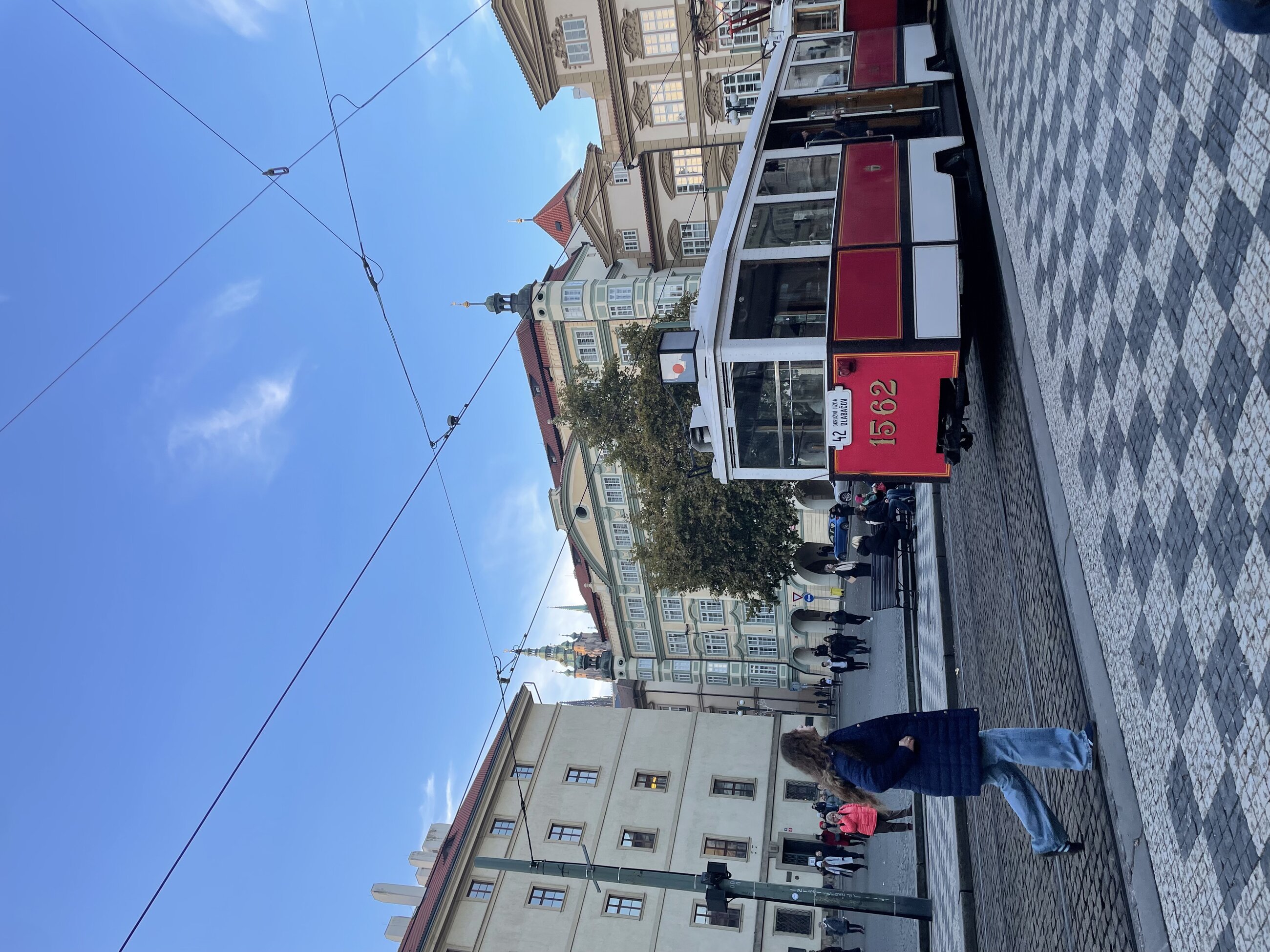 a typicaly tram and the city square where it has a stop in prague